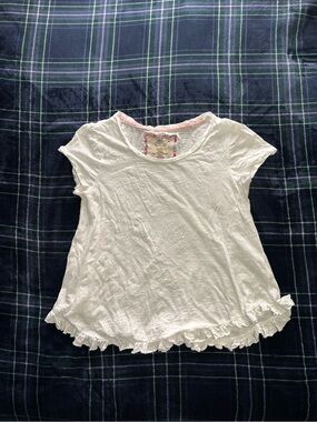 White Cupio flowy top with ruffle trim. Size M.